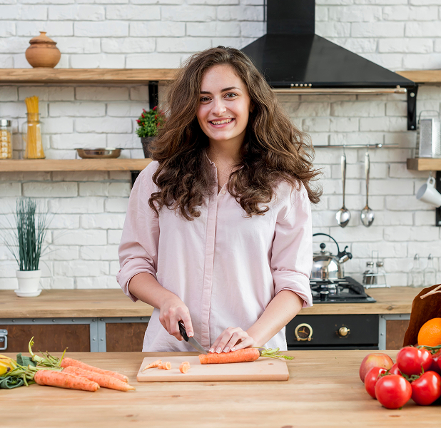 Woman preparing food on cutting board